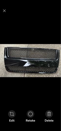 Glossy black mesh replacement grille, specifically designed to fit 2007-2010 Ford Explorer Sport Trac models.