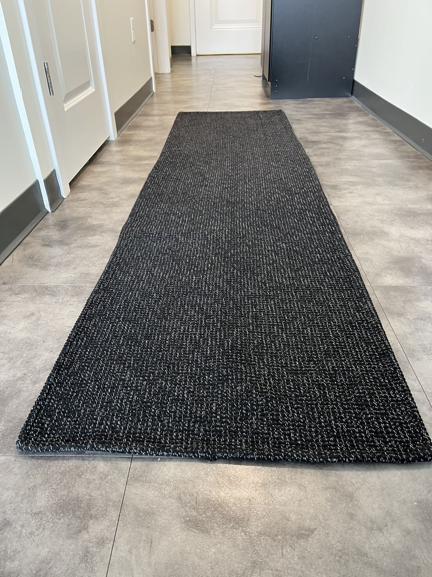 Two runner rugs - grey and black - $10 each