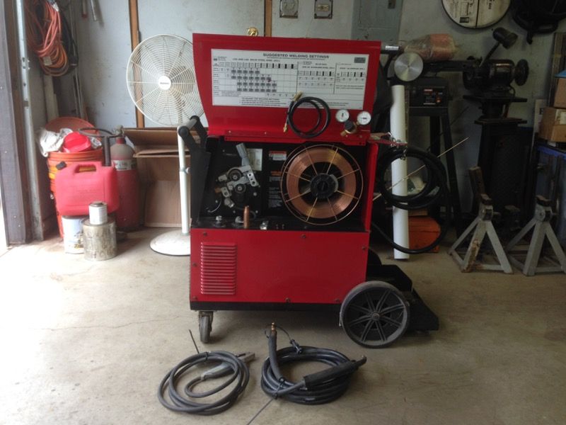 Mig welder, Lincoln Electric Power Mig 215 Welder. (price is firm)