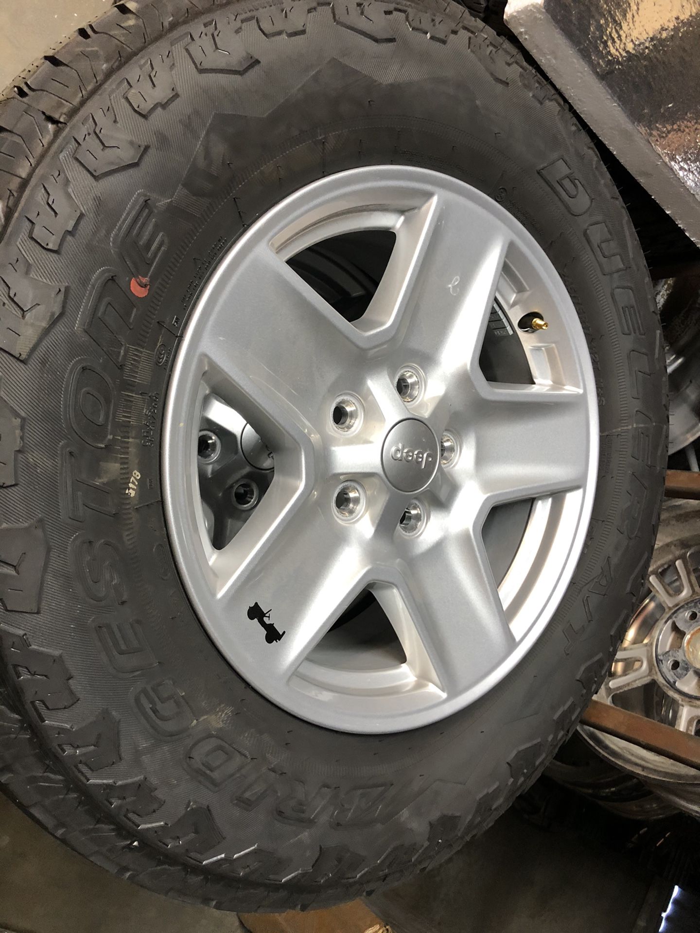 Jeep 17” wheel with Bridgestone Dueler A/T tires like new