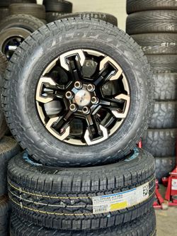 Used Stock Chevy Wheels 18” With New Tires 275/65/18 Falken 