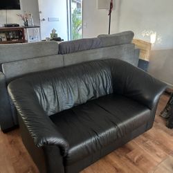 Black Love Seat And Coffee And End Table