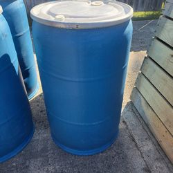 (4) Left. Uline 55 gallon plastic drums with lock top