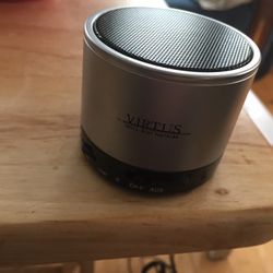 round mini.   silver/black bluetooth speaker