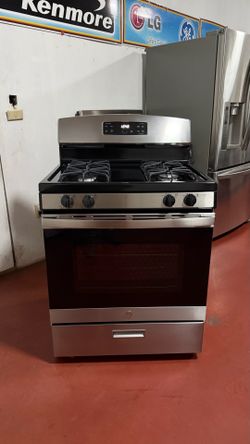 GE 4-burner gas stove in perfect working condition. Delivery and installation available with a 3-month warranty.