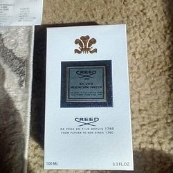 Brand new Creed silver mountain water
