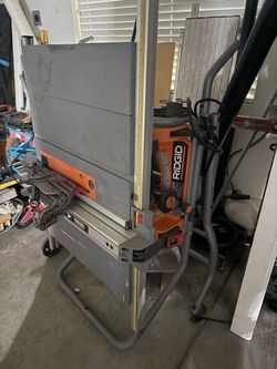 RIDGID Table Saw with Stand and wheels. 10 inch blade . Need it gone don't use it as much as I thought I would.