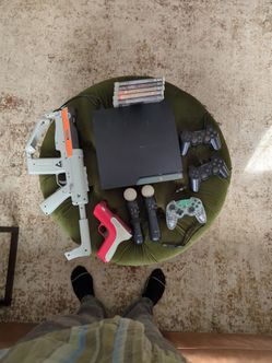 PS3 Slim with standard and Move controllers and games