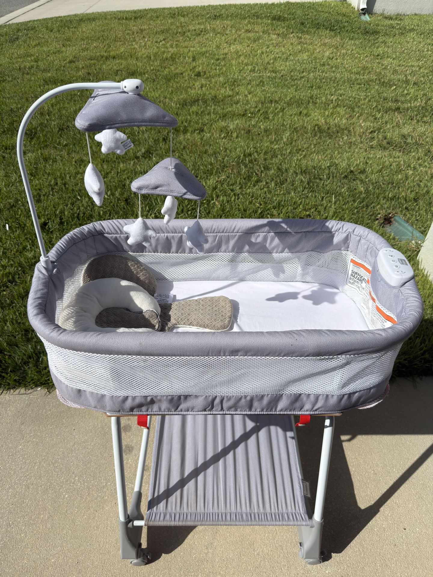 Selling a bassinet with sound and mobile.