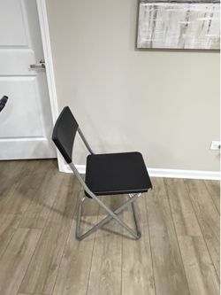 12 black folding chairs