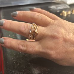 Bundle of 4 gold rings, including a stackable ring and a heart-shaped rings Size 8