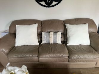 Tan leather sofa.