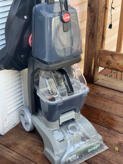 Hoover TurboScrub vertical carpet cleaner, SpinScrub 50 model, designed for deep cleaning.
