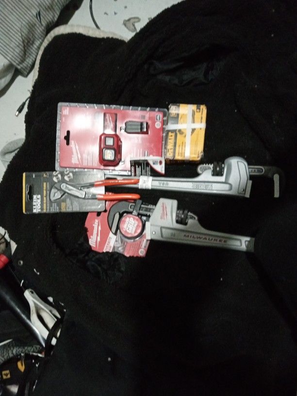 Misc. Things, 2 Pipe Wrenches, DeWalt 12v Battery, Milwaukee Headlamp 450, Klein Pliers