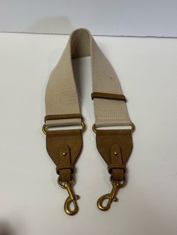 This beige Zara crossbody bag strap features tan leather details and gold-tone hardware.