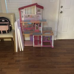 Barbie house and a bunch of accessories 