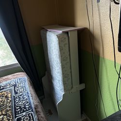 White toddler bed frame with mattress