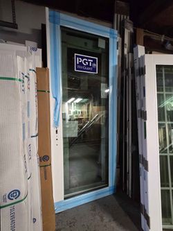Brand New 74W x 94H PGT Impact Double French Doors with Frame, Trims and Handles.