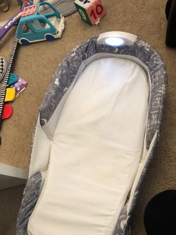 Snuggle Nest travel baby bed with light and music