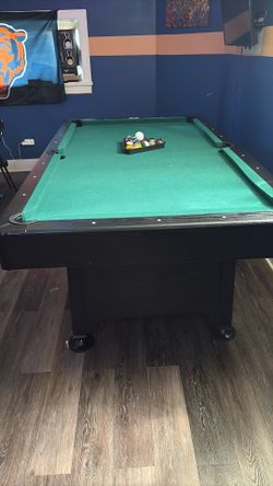 Pool table/ sticks/ 2 sets of poll balls