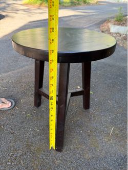 Round wooden side table