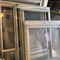 Aluminum storm windows selling individually $20 per item pick up Milwaukee area or we can deliver for a fee