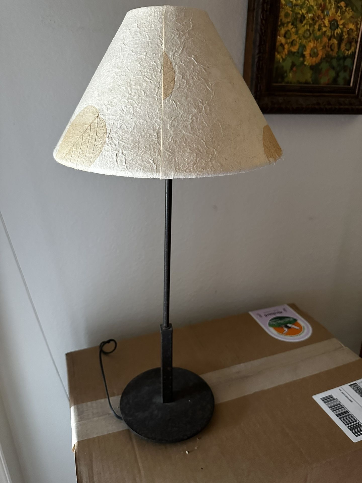 Vintage 21” tall dark bronze candle stick style table lamp with dried leaf shade.