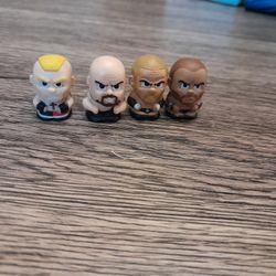 4 WWE Mini Figures
