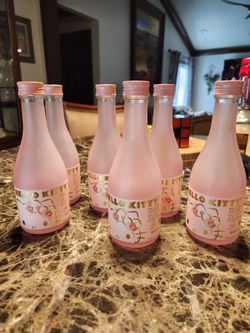 Six Empty HELLO KITTY SAKE BLOTTLES