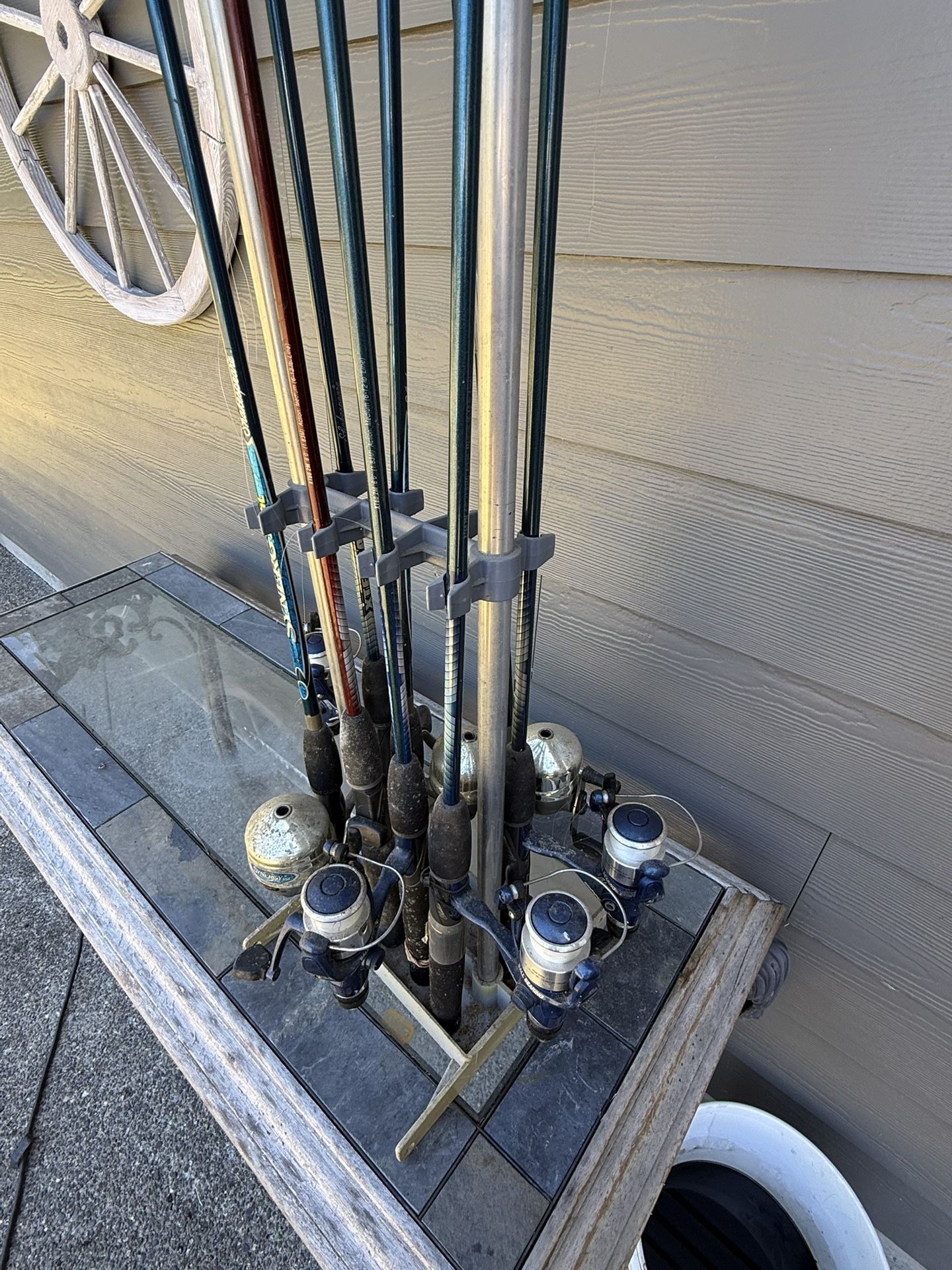 Fishing Rod Holder And Old Poles And Reels