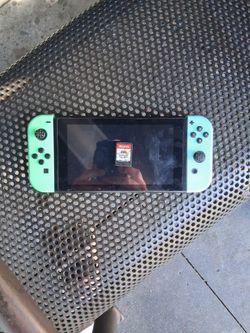 Nintendo Switch with Green Joy-Cons