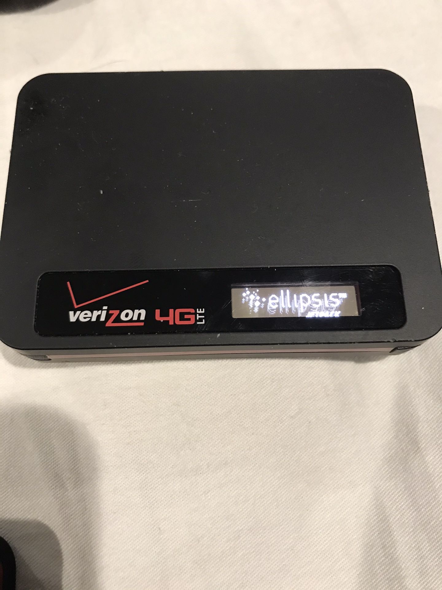 Three Verizon wireless hotspot. And one phone