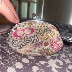 Vintage Coach Poppy butterfly and graffiti print kisslock pouch featuring a playful mix of colorful graphics and silver-tone hardware.