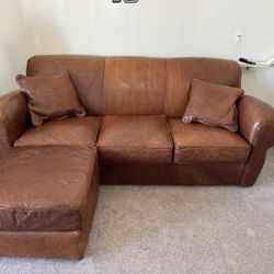  leather sofa with a matching ottoman