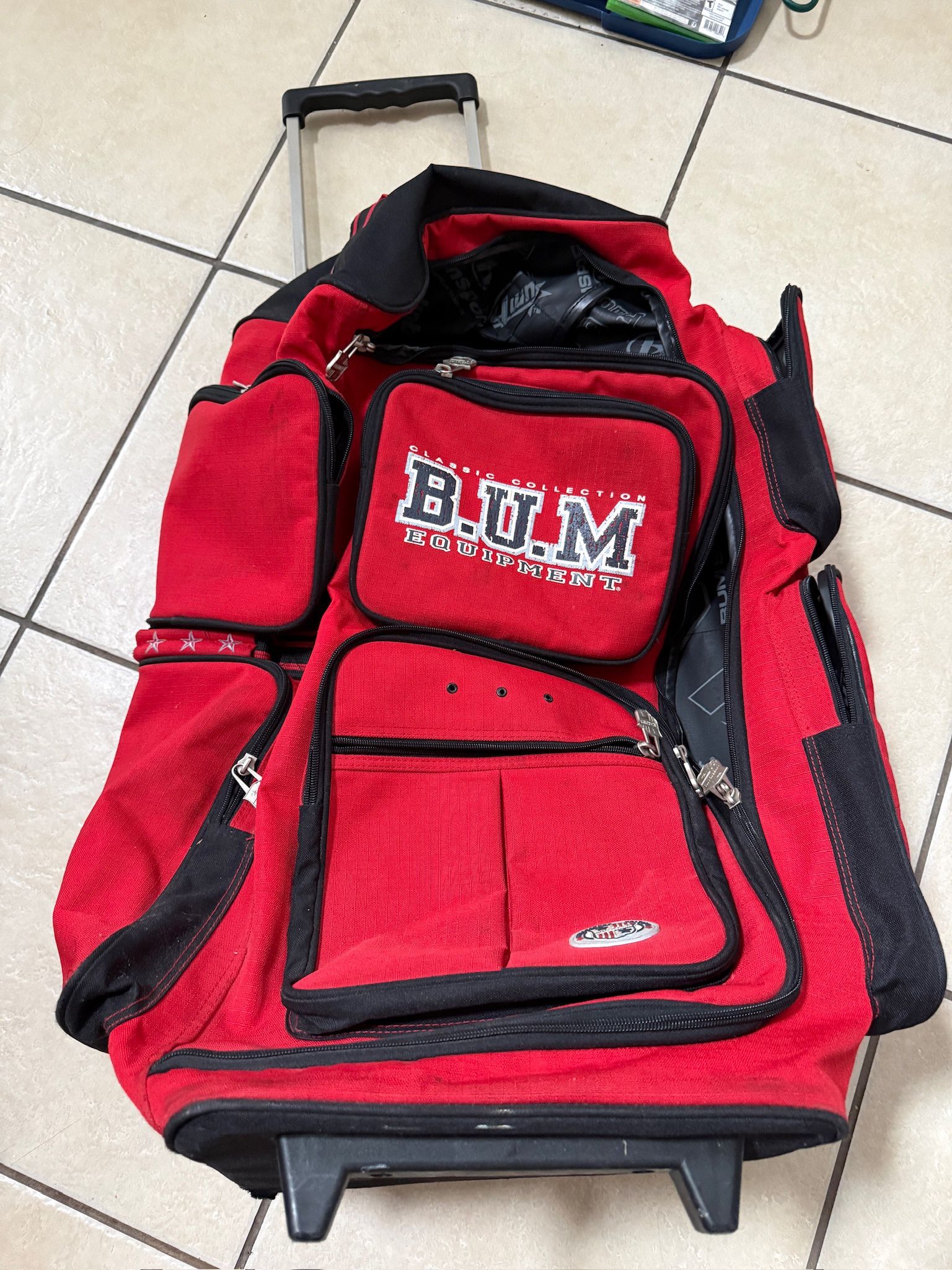 B.U.M is Equipment Rolling Duffel Bag – Red/Black (Good Condition)