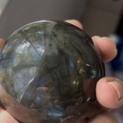 Beautiful polished labradorite sphere with natural blue/green flash.
