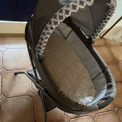 Bassinet and  baby swing