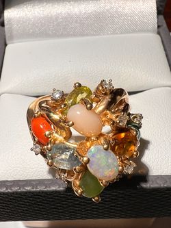 Multi-gemstone Multi-gemstone gold ring with coral, opal, amethyst, and diamonds