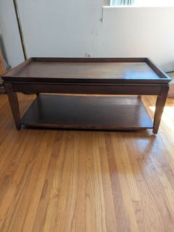 wooden lift-top coffee table