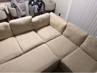 Beige couches  with pullout bed