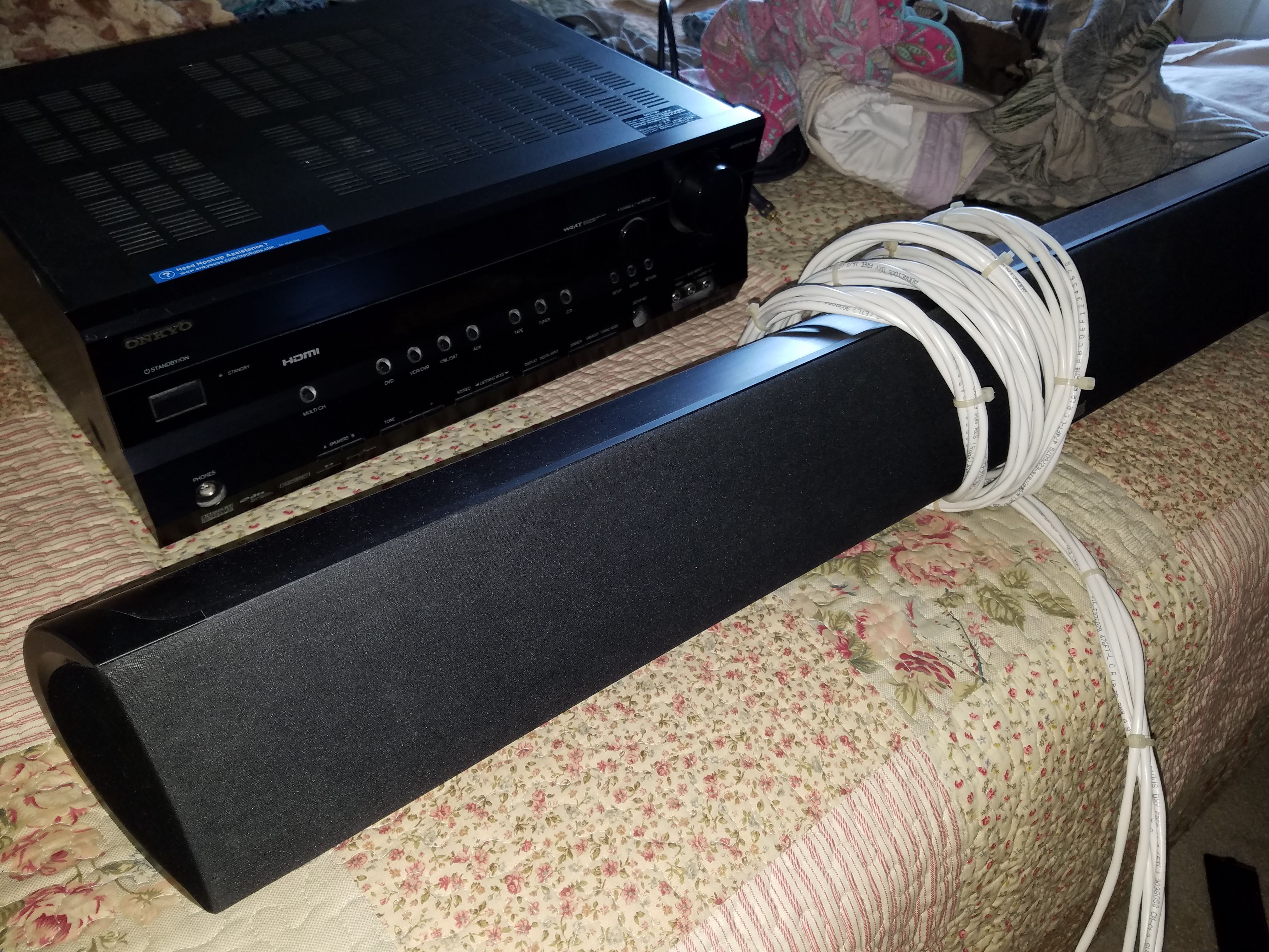 Like New Onkyo TX-SR505 Reciever, coupled with a Polk Audio Soundbar and bookshelf speaker (woofer. Receiver is 7.1 channels and 160 watts.