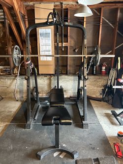 Squat rack w/ cable pull down and row, weights, extras