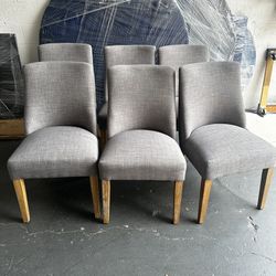 6 grey upholstered dining chairs with wooden legs h:35 in 