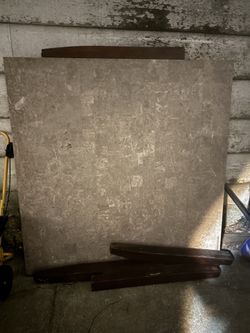 “Solid stone table (marble/travertine). Very heavy and high quality. Legs need repair – great project or for custom base.”