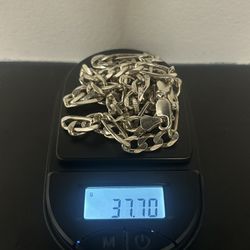 Silver Figaro link chain