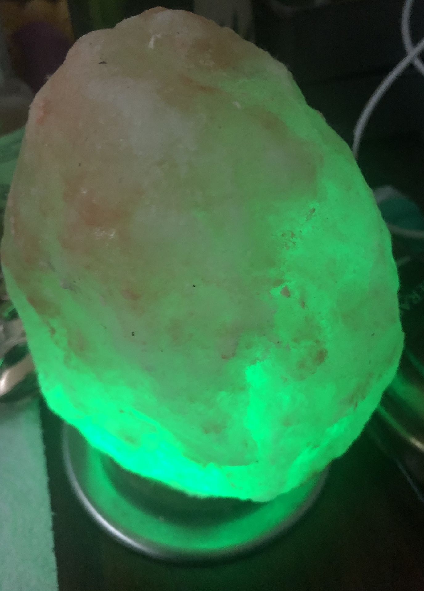 Multicolor glowing Himalayan salt lamp.