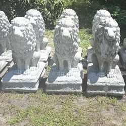 solid concrete lions $100 each,,  