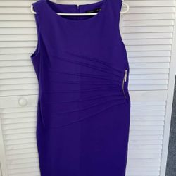 New This is a purple Ivanka Trump sheath dress with a golden zipper on the side and pleats (drapery). The dress is made of knitted fabric, has a round