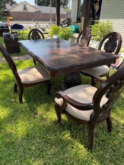 Wooden dining table with extension