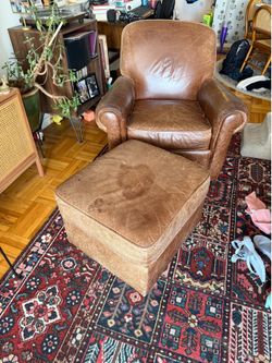 Leather arm chair and ottoman
